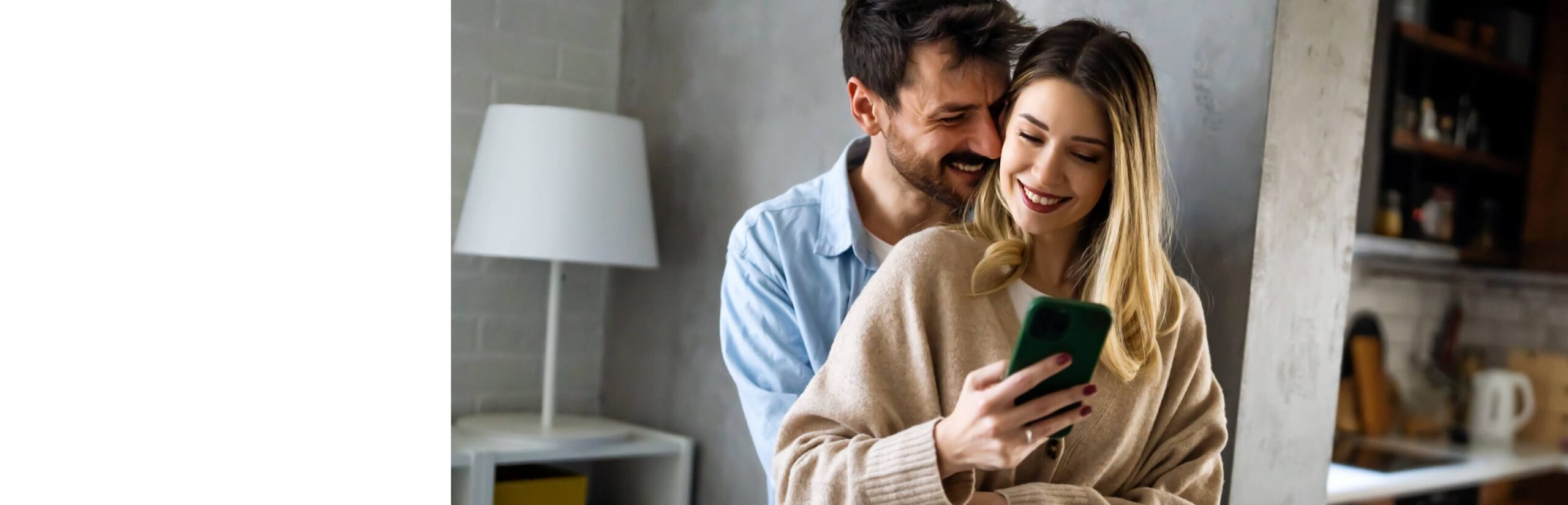 young-happy-couple-using-phone-to-share-social-med-2024-01-22-17-00-25-utc (1)