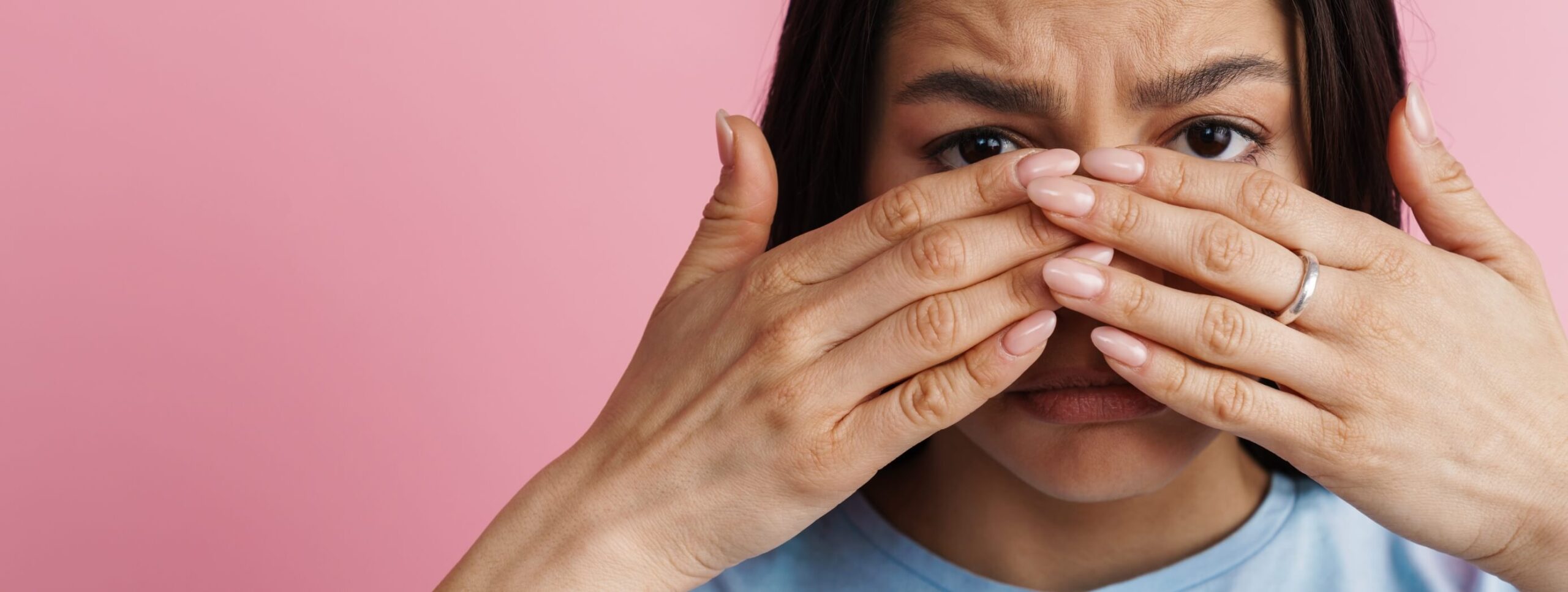 young-hispanic-scared-woman-covering-her-face-and-2023-11-27-05-19-55-utc (1)