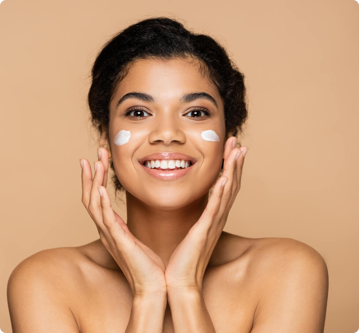 joyful-african-american-woman-with-face-cream-on-c-2023-11-27-05-14-54-utc (1)